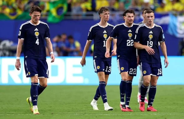 Disappointed Scotland players after their World Cup elimination was confirmed